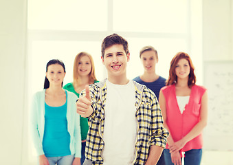 Image showing male student with classmates showing thumbs up