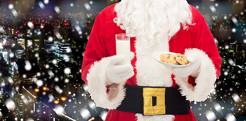 Image showing santa claus with glass of milk and cookies