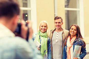 Image showing group of smiling friends taking photo outdoors