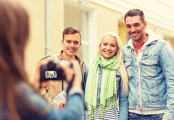 Image showing group of smiling friends taking photo outdoors