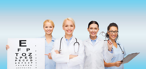 Image showing smiling female eye doctors and nurses