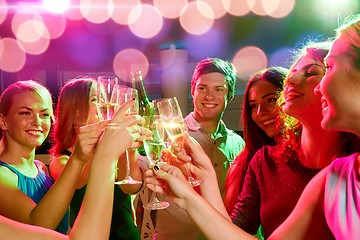 Image showing smiling friends with wine glasses and beer in club