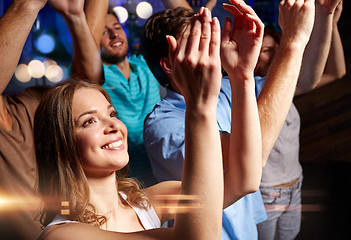 Image showing smiling friends at concert in club