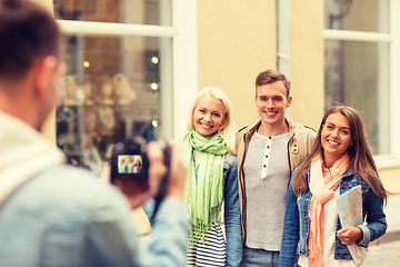 Image showing group of smiling friends taking photo outdoors