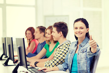 Image showing female student with classmates in computer class