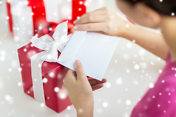 Image showing close up of woman with letter and presents