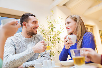 Image showing happy couple meeting and drinking tea or coffee