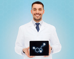 Image showing smiling male doctor showing tablet pc screen