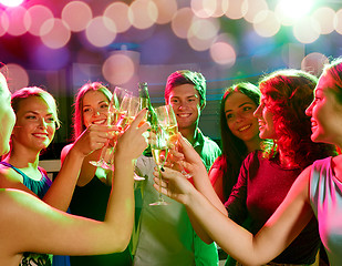 Image showing smiling friends with wine glasses and beer in club