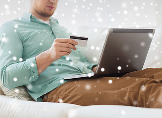 Image showing close up of man with laptop and credit card