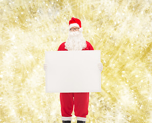 Image showing man in costume of santa claus with billboard