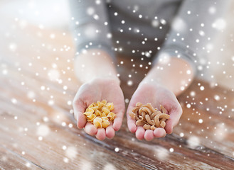 Image showing female hands with different pasta variations