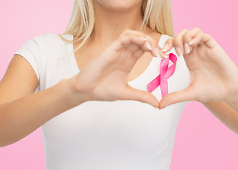 Image showing close up of woman and pink cancer awareness ribbon