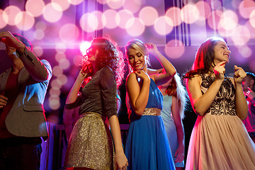 Image showing smiling friends dancing in club