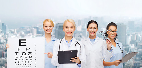 Image showing smiling female eye doctors and nurses