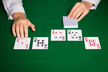 Image showing holdem dealer with playing cards