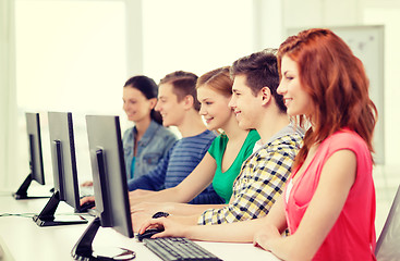 Image showing female student with classmates in computer class