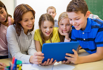 Image showing group of kids with teacher and tablet pc at school