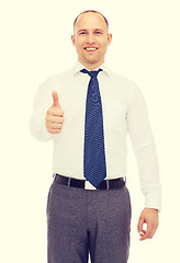 Image showing smiling businessman showing thumbs up