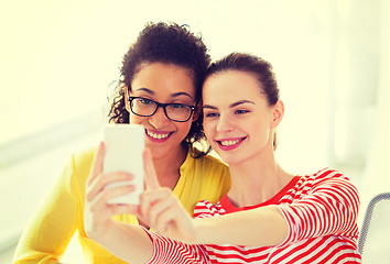 Image showing girlfriends taking selfie with smartphone camera
