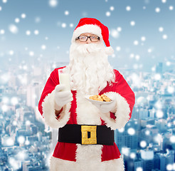 Image showing santa claus with glass of milk and cookies