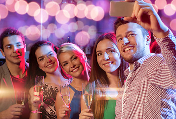 Image showing friends with glasses and smartphone in club