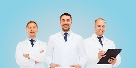 Image showing group of smiling male doctors in white coats