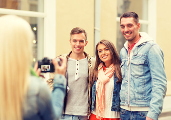 Image showing group of smiling friends taking photo outdoors