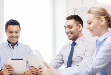 Image showing business team working with tablet pc in office