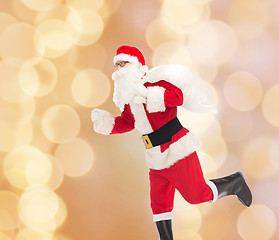 Image showing man in costume of santa claus with bag