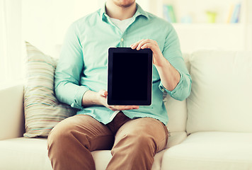 Image showing close up of man with tablet pc computer at home