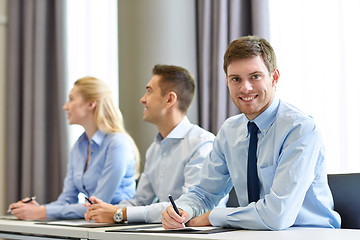 Image showing group of smiling businesspeople meeting in office