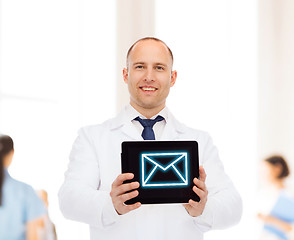 Image showing smiling male doctor with tablet pc