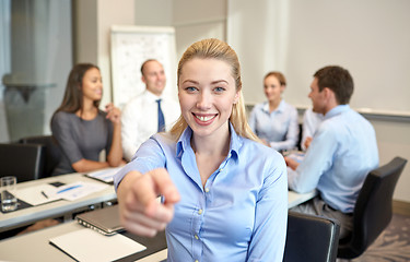 Image showing group of smiling businesspeople meeting in office