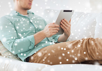 Image showing close up of man with tablet pc computer at home