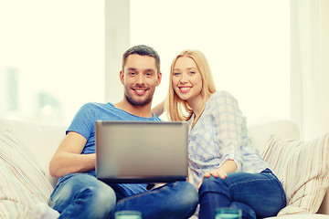 Image showing smiling happy couple with laptop at home