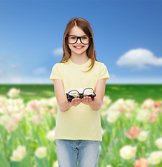 Image showing smiling cute little girl in black eyeglasses