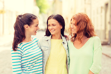 Image showing smiling teenage girls with on street