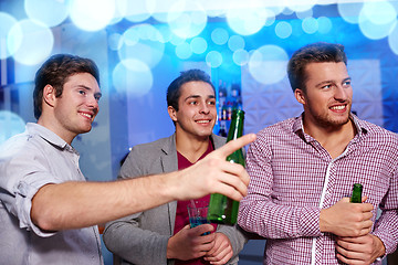 Image showing group of male friends with beer in nightclub