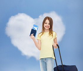 Image showing smiling girl with travel bag ticket and passport