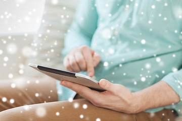 Image showing close up of man with tablet pc computer at home