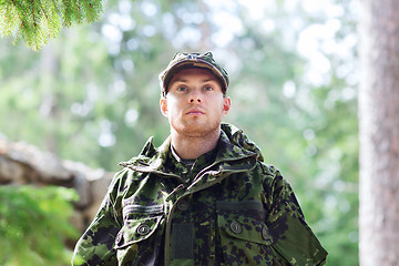 Image showing young soldier or ranger in forest