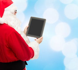 Image showing man in costume of santa claus with tablet pc