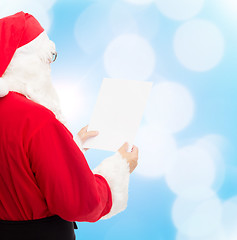 Image showing man in costume of santa claus with letter