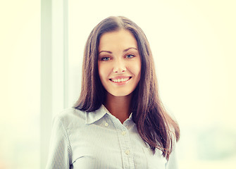 Image showing happy businesswoman in office