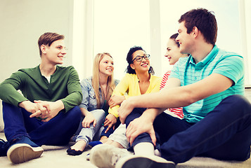 Image showing five smiling teenagers having fun at home