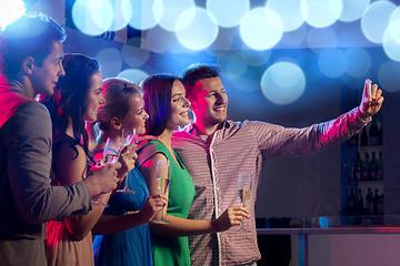 Image showing friends with glasses and smartphone in club