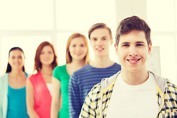 Image showing smiling male student with group of classmates