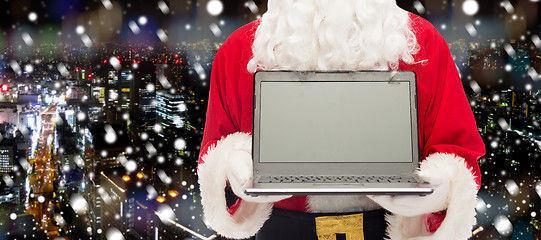 Image showing close up of santa claus with laptop