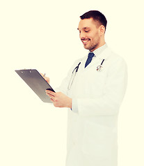 Image showing smiling male doctor with clipboard and stethoscope